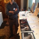 Michael with donated prints Michael with donated prints